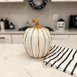 decorative white pumpkin with gold lines neutral autumn decor
small white pumpkins gold accents coffee table fall styling
elegant fall decor pumpkins white gold home accessories
white gold pumpkin decor styled in neutral kitchen aesthetic
minimalist fall decor white pumpkins gold accent styling
modern neutral home decor white pumpkins fall aesthetic
white pumpkin decor styled shelf neutral fall home