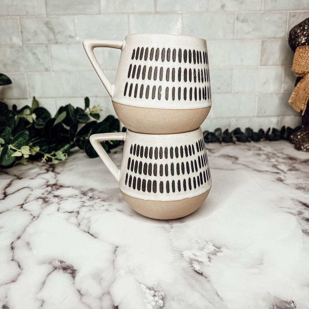 Brown coffee mugs with lines and stripes on them