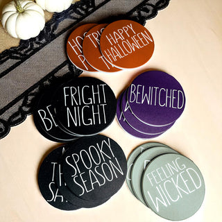 Black Halloween ceramic coaster set with spooky sayings and cork backing
Orange Halloween coasters featuring classic Halloween phrases
Purple witch-themed ceramic drink coasters with cork back
