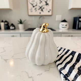 elegant fall home decor white pumpkins modern aesthetic
white ceramic pumpkin decorations for neutral home styling
white pumpkins styled on neutral shelf modern fall decor
minimalist kitchen decor white pumpkin gold accent styling
white pumpkin decor styled in beige aesthetic home
neutral fall decor white pumpkins on coffee table
