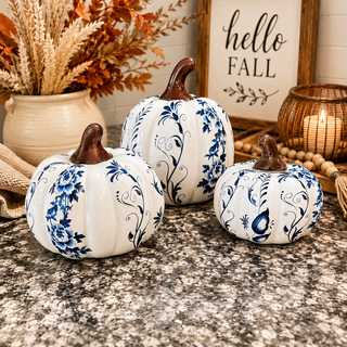 Blue and white ceramic pumpkins for tablescape
Blue floral pumpkins for seasonal shelf styling
White pumpkins with blue vine design
Chinoiserie pumpkins for chic Halloween decor
Blue and white pumpkins for dining table decor