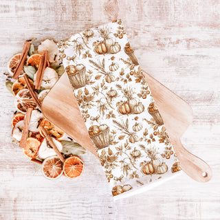 autumnal pumpkin towel draped over farmhouse sink
pumpkin themed cotton kitchen towel perfect for fall gifting
thanksgiving pumpkin kitchen linen folded on serving tray
cozy autumn breakfast scene with pumpkin print towel
