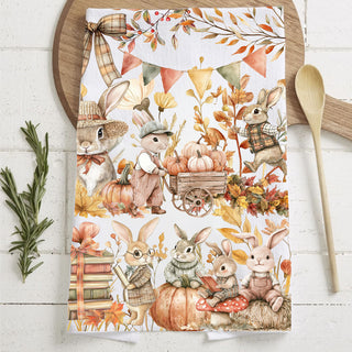 fall rabbit kitchen towel beside wooden spoon and herbs
storybook bunny and pumpkin design flour sack towel
neutral autumn bunny towel for farmhouse fall décor
cozy fall vignette with bunny kitchen towel and mini pumpkins
storybook woodland bunny towel perfect for nursery or play kitchen