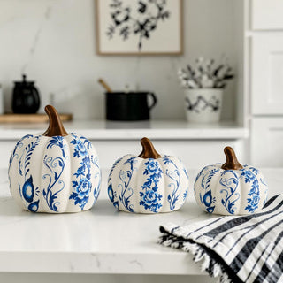 resin pumpkins blue white floral design fall decorating ideas
neutral fall decor blue white pumpkins minimalist home styling
blue and white pumpkin set for coffee table fall display ideas
blue and white pumpkin decor styled in modern farmhouse kitchen
neutral home decor pumpkins blue white for minimalist interiors
chinoiserie pumpkins styled on kitchen island fall decor