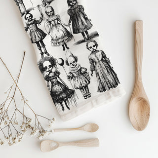 horror movie fan halloween kitchen towel with dolls
creepy porcelain doll print towel for haunted house décor
unique halloween towel with black and white clowns