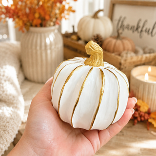 Cream and gold pumpkin shelf decor
White and gold pumpkin centerpiece decor
Resin pumpkins for farmhouse fall decor
Boho pumpkin decor in cream and gold
Neutral fall decorations with white pumpkins
Ivory pumpkins with gold painted lines
Cream resin pumpkin set for autumn decorating
White pumpkins with gold accents for home decor
Gold accented pumpkin decorations for fall
Elegant fall pumpkin set in ivory and gold
Neutral Halloween pumpkin decorations