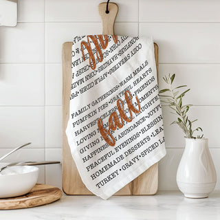 fall home styling using typography flour sack towel
seasonal fall kitchen towel with list of autumn traditions
autumn phrase towel paired with pumpkins and candles
fall dish towel for pumpkin spice and sweater weather fans