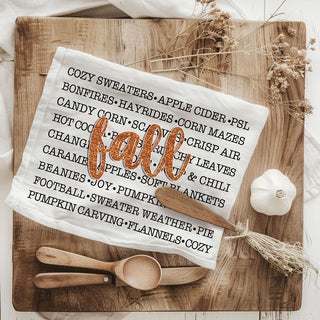 fall print kitchen towel for holiday entertaining
autumn home essentials fall text cotton dish towel
fall phrases towel layered with plaid napkins for tablescape
cozy fall kitchen accessory with modern typography print