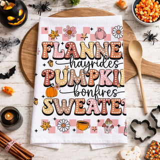 pink october kitchen towel for cozy halloween nights
pink and orange fall and halloween tea towel 
soft pink harvest towel with pumpkins and bonfire mug art
pink fall aesthetic towel for cottagecore halloween décor
