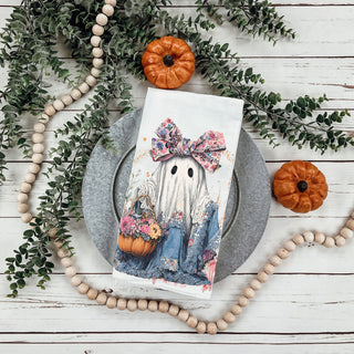 soft pastel halloween tea towel for cozy kitchen
pink farmhouse fall towel with sweet ghost illustration
ghost in denim dress flour sack towel on cutting board
pretty halloween décor towel with flowers pumpkins and ghost
