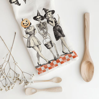 vintage style skeleton kitchen towel with pumpkin head friend
retro halloween flour sack towel with three ghoul squad girls
orange checkerboard halloween towel with vintage witch illustration
mid century style halloween dish towel pumpkin woman and skeleton