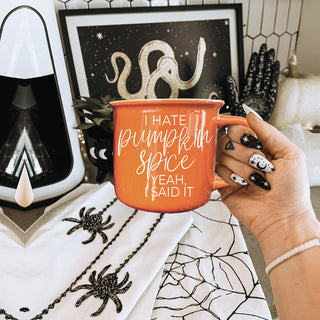 orange ceramic coffee mug lifestyle photo
fall themed mug for people tired of pumpkin spice
autumn kitchen decor mug with funny phrase
cozy fall scene with sarcastic orange coffee cup