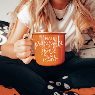 office desk fall mug with funny anti pumpkin quote
autumn caffeine mug for psl skeptics
trendy fall coffee mug with humorous phrase
orange fall mug styled with sweater and candle