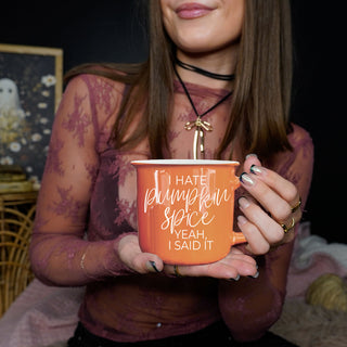 funny seasonal mug with minimalist fall styling
orange mug with fall candle and mini pumpkins
cozy living room setup with sarcastic fall mug