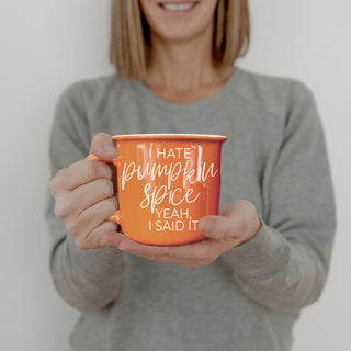 autumn breakfast table with coffee and orange mug
funny fall drinkware on neutral background
orange coffee cup in boho fall home decor