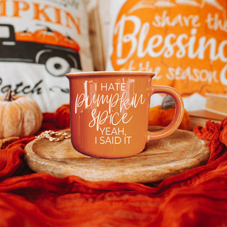 halloween coffee cup with cheeky phrase
autumn drinkware for sarcastic coffee lovers
funny fall mug next to pumpkins and leaves
orange coffee mug in cozy fall flatlay