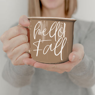 hello fall fall decor mug for entryway coffee table
hello fall mug with rustic autumn design
hello fall fall themed coffee cup on white background
hello fall coffee cup in neutral boho living room
hello fall mug with caramel drizzle latte on saucer
