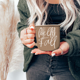hello fall autumn mug next to sweater and book
hello fall ceramic mug for pumpkin spice latte
hello fall mug in farmhouse kitchen decor