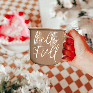 hello fall script mug on wooden tray
hello fall fall themed mug for cozy mornings
hello fall mug with cinnamon sticks and coffee