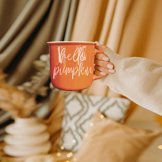 fall themed coffee mug in neutral boho bedroom
hello pumpkin mug close up of orange enamel style
pumpkin patch ready mug with hello pumpkin quote