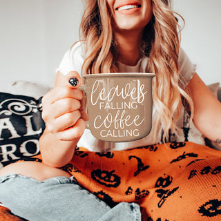 cozy fall coffee cup with leaves falling coffee calling text
neutral brown autumn mug for coffee lovers
fall gift mug with leaves falling coffee calling saying
autumn leaves themed coffee mug on countertop
brown ceramic fall mug for pumpkin spice and coffee