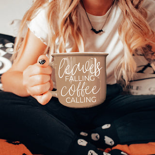 leaves falling coffee calling mug on wooden tray
brown leaves falling coffee calling coffee mug
fall coffee mug with leaves falling coffee calling quote
autumn kitchen decor brown mug leaves falling coffee calling