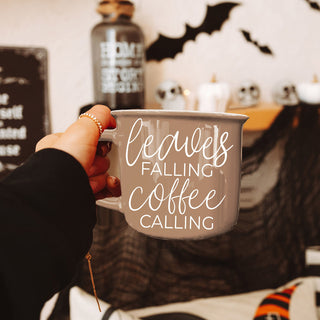 leaves falling coffee calling mug with mini white pumpkins
autumn coffee bar decor with brown leaves falling mug
fall kitchen shelf styling with leaves falling coffee calling cup
cozy fall morning scene with brown quote mug
leaves falling coffee calling mug on rustic wood board