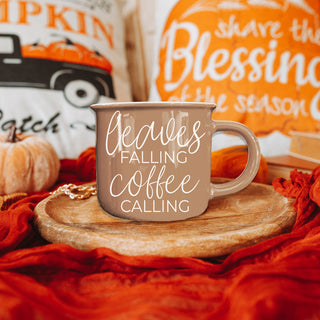autumn coffee mug gift for her leaves and coffee design
brown fall mug with script leaves falling coffee calling
neutral farmhouse fall mug for kitchen decor
leaves and coffee themed autumn drinkware