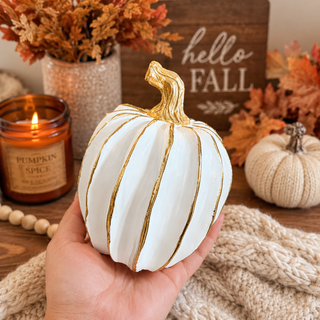 decorative white pumpkin with gold lines neutral autumn decor
small white pumpkins gold accents coffee table fall styling
elegant fall decor pumpkins white gold home accessories
white gold pumpkin decor styled in neutral kitchen aesthetic
minimalist fall decor white pumpkins gold accent styling
modern neutral home decor white pumpkins fall aesthetic
white pumpkin decor styled shelf neutral fall home