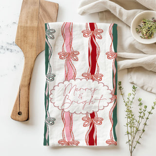 christmas towel for farmhouse holiday kitchen vibe
holiday kitchen towel for everyday festive use
festive christmas tea towel with bow ribbon stripe design
holiday kitchen cloth merry bright script with ribbon accents
christmas linen towel decorative bow pattern seasonal decor
pink striped christmas dish towel with tied ribbon bow print
holiday hand towel with festive bow detailing kitchen decor
