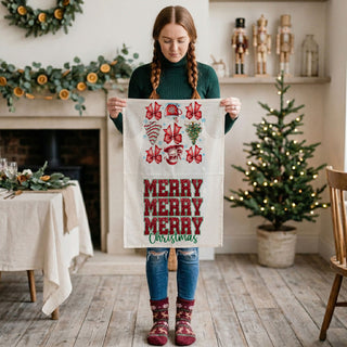 lightweight flour sack towel with holiday print and festive text
soft textured christmas towel for kitchen and baking use
kitchen linen towel with printed holiday artwork and message
absorbent dish towel with festive christmas pattern and design
cotton tea towel with decorative christmas themed print