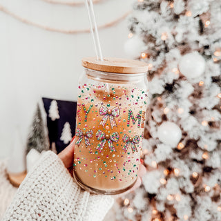 Merry holiday coffee mug – festive glass cup for Christmas kitchen or office
Sparkly Christmas coffee tumbler – colorful glass cup with Merry lettering
Holiday coffee bar decor – glass cup with glitter, sequins, and colorful bows