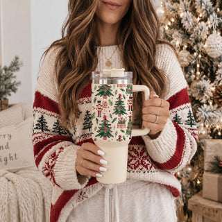 holiday tumbler with decorated Christmas trees
nutcracker soldier Christmas cup with festive greenery
vintage inspired Christmas nutcracker tumbler
retro nutcracker holiday cup
nostalgic nutcracker Christmas drinkware
old fashioned nutcracker Christmas tumbler
classic holiday nutcracker tumbler
traditional Christmas nutcracker cup
Christmas tumbler with red green and pink details
feminine nutcracker Christmas tumbler
preppy nutcracker Christmas drinkware
grandmillennial nutcracker holiday tumbler
