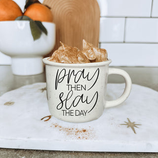 lifestyle photo of woman with pray then slay mug
Christian coworker gift pray then slay coffee cup
inspirational drinkware for Christian women
cute Christian mug for desk at work
coffee bar decor mug with pray then slay saying
Christian birthday gift mug for her
neutral farmhouse style Christian quote mug
script font pray then slay the day design
Christian self care morning coffee cup