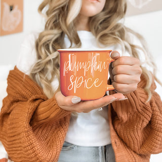 cozy thanksgiving morning coffee in orange autumn mug
autumn color pop mug in neutral living room decor
fall and halloween hosting essentials with orange mug