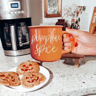 autumn living room coffee table decor with mug
seasonal drinkware display with multiple fall mugs
halloween themed bar cart with coffee mugs
fall apartment decor with orange accent mug