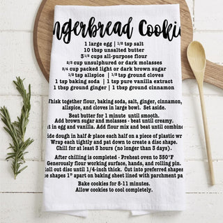 decorative baking towel christmas recipe print
christmas towel with recipe for homemade cookies
kitchen towel that shows gingerbread recipe steps
holiday dish towel with baking recipe design
recipe towel for christmas cookie baking decor