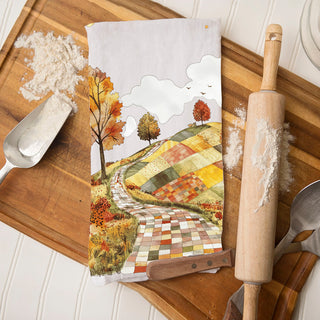 fall leaves and country road towel for seasonal decorating
autumn stroll dish towel with patchwork countryside
cozy fall kitchen towel with path through foliage
fall road and meadow towel for rustic dining room décor
autumn tree lined path towel for thanksgiving hostess gift