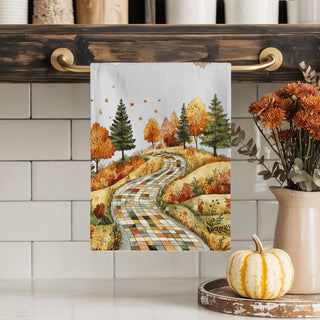 harvest season kitchen towel with patchwork hill and trees
fall farmhouse towel with scenic road and golden leaves
woodland autumn path tea towel for rustic cabin kitchen
fall baking towel with quilt pattern path and trees