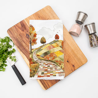 patchwork fall fields kitchen towel with winding lane
fall forest road towel for pumpkin spice coffee bar
harvest landscape dish towel with orange yellow trees
autumn village road style towel for cozy home décor
winding stone path towel for fall cabin kitchen