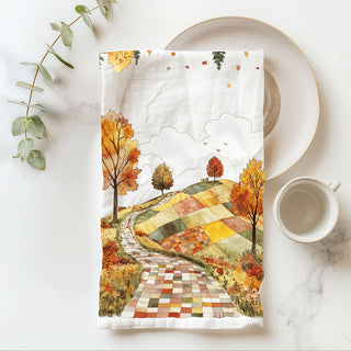 fall kitchen décor towel with quilted path and orange trees
scenic autumn road dish towel for cozy cottage kitchen
winding fall path tea towel hanging on oven handle
colorful patchwork hillside towel with fall foliage