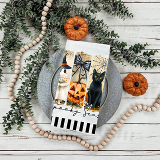 cute ghost halloween towel for non scary spooky décor
floral ghost and pumpkin halloween cotton kitchen towel
spooky season tea towel with cobwebs and gravestone art
playful spooky season towel for fun modern halloween decorating