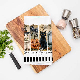 modern spooky art towel for chic halloween decorating
black cat and gravestone towel for haunted house décor
spooky season hand towel for bathroom or powder room
cute halloween ghost towel for entryway ladder styling