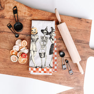 farmhouse halloween kitchen towel with pumpkin head lady
vintage sketch halloween towel with skeleton and witches
old fashioned spooky season towel with orange checks
retro halloween trio towel for fall coffee station