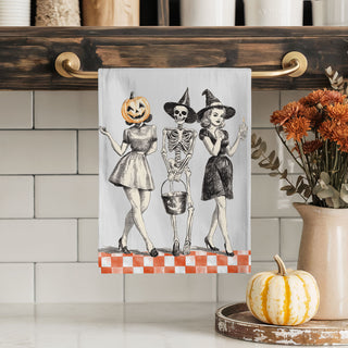 black and orange vintage halloween tea towel for kitchen
retro halloween kitchen décor towel with skeleton carrying candy bucket
vintage inspired halloween women towel for spooky season
old fashioned halloween towel with pumpkin head lady and witch