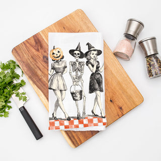 vintage halloween hostess gift towel for farmhouse kitchen
retro spooky kitchen towel with witch skeleton and pumpkin head art
classic halloween pinup towel hanging on oven handle
pumpkin head vintage girl towel for fall home décor