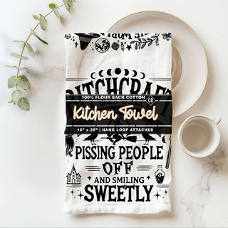 funny witch kitchen towel in a world full of witches be the bad one
bitchcraft halloween dish towel the art of pissing people off
sarcastic witch quote flour sack towel for spooky kitchen décor
black and white witchy kitchen towel with funny sayings