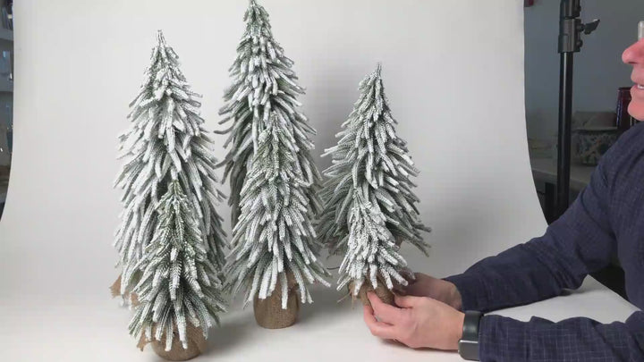 Hanamde Fake Trees with Fake snow on them for Christmas