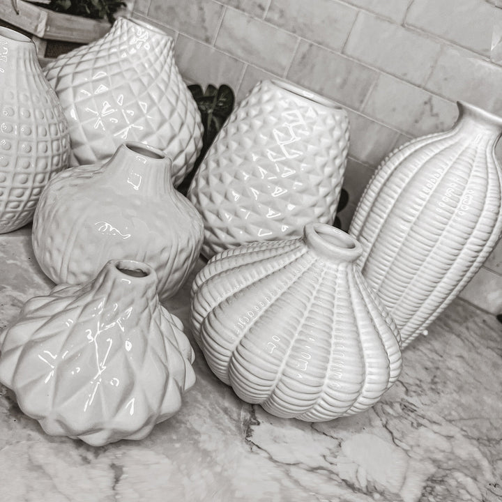 Detailed White Vases in Various Sizes